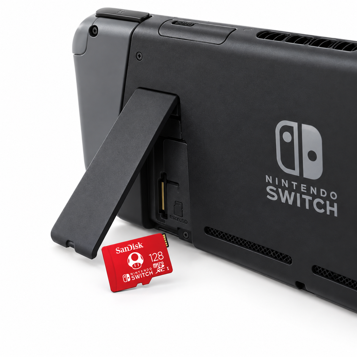 SanDisk 128GB microSDXC card beside Nintendo Switch card slot